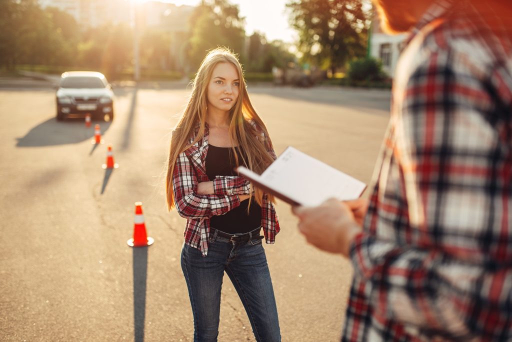 Male instructor and female student, driving school